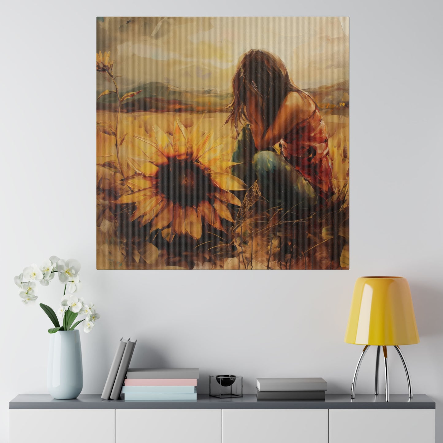 A painting capturing the emotive art of a human experience, with a person sitting amongst sunflowers symbolizing loyalty and adoration, hangs above a modern sideboard with decorative items.
Elena Duval: Solace in Solitude. Exclusive Canvas Print by Printify.